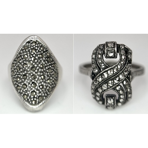 656 - 2 X STERLING SILVER MARQUISITE SET RINGS. 8.7G IN TOTAL WEIGHT. SIZES R & N. (1 stone missing)
Ref: ... 