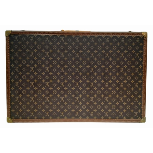 227 - A Vintage Louis Vuitton Trunk/Suitcase. Monogram canvas and brown leather trim exterior. Brass corne... 