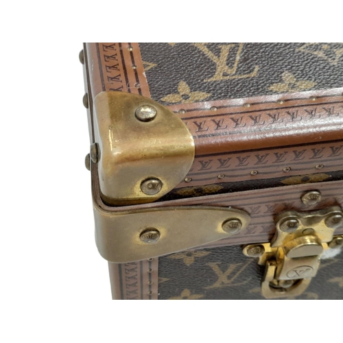 227 - A Vintage Louis Vuitton Trunk/Suitcase. Monogram canvas and brown leather trim exterior. Brass corne... 