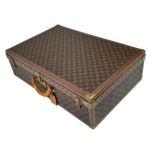 227 - A Vintage Louis Vuitton Trunk/Suitcase. Monogram canvas and brown leather trim exterior. Brass corne... 