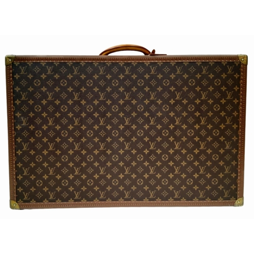 227 - A Vintage Louis Vuitton Trunk/Suitcase. Monogram canvas and brown leather trim exterior. Brass corne... 