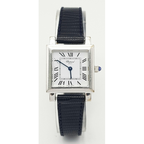 108 - A FABULOUS TANK STYLE CHOPARD LADIES WATCH IN 18K GOLD AND ON A BLACK LEATHER STRAP .   22 X 22mm