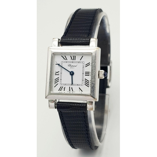 108 - A FABULOUS TANK STYLE CHOPARD LADIES WATCH IN 18K GOLD AND ON A BLACK LEATHER STRAP .   22 X 22mm