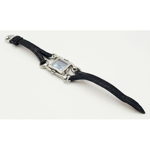 169 - A GUCCI DESIGNER LADIES WATCH WITH UNIQUE DESIGN FEATURES ON A BLACK LEATHER STRAP  ,   20 X 20mm