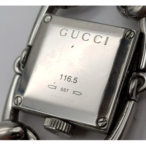 169 - A GUCCI DESIGNER LADIES WATCH WITH UNIQUE DESIGN FEATURES ON A BLACK LEATHER STRAP  ,   20 X 20mm