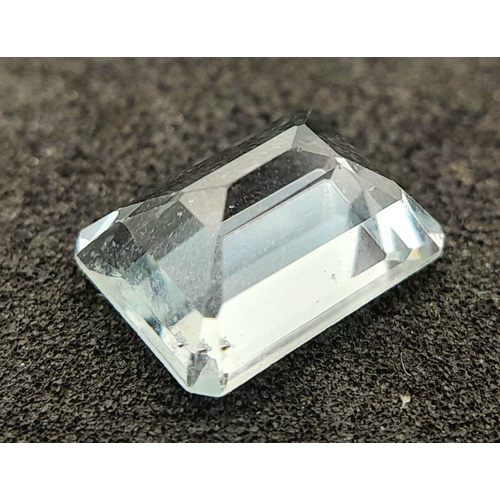 183 - A 1.71ct NATURAL AQUAMARINE IN EMERALD SHAPE , COMES WITH INDEPENDANT LABORATORY REPORT .