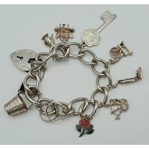 195 - Vintage SILVER CHARM BRACELET. All links marked for Silver. Lovely selection of charms to include pe... 