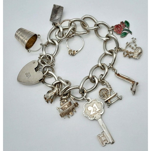 195 - Vintage SILVER CHARM BRACELET. All links marked for Silver. Lovely selection of charms to include pe... 