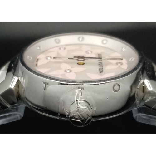 206 - A LOUIS VUITTON LADIES WATCH IN STAINLESS STEEL WITH DIAMOND NUMERALS AND DECORATION .    28mm