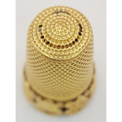 25 - A 9K GOLD ORNATE THIMBLE .     6.1gms