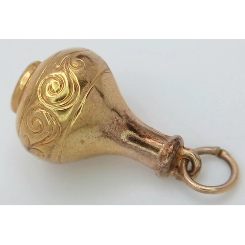 273 - Hallmarked  9 carat GOLD CHARM in the form of a Wine Flask. 1.06 grams.