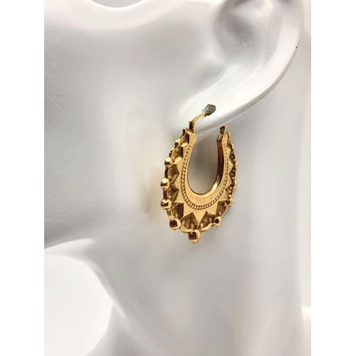 291 - A pair of Fancy 9K Yellow Gold Hoop Earrings. Total weight 2.8g. Ref 1620I/1636I