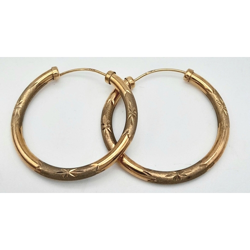 319 - A Pair of Vintage 9K Yellow Gold Hoop Earrings. 3cm diameter. 1.9g total weight.