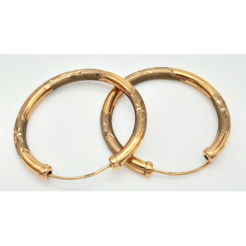 319 - A Pair of Vintage 9K Yellow Gold Hoop Earrings. 3cm diameter. 1.9g total weight.