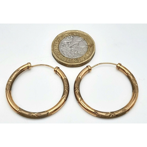 319 - A Pair of Vintage 9K Yellow Gold Hoop Earrings. 3cm diameter. 1.9g total weight.