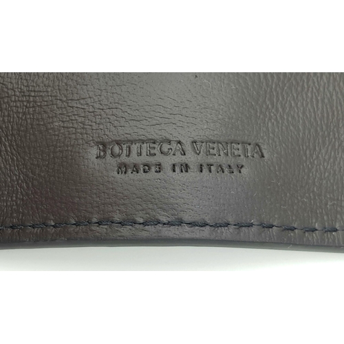 331 - A BOTTEGA VENETA WOVEN LEATHER KEY CASE, AS NEW WITH DUST COVER .