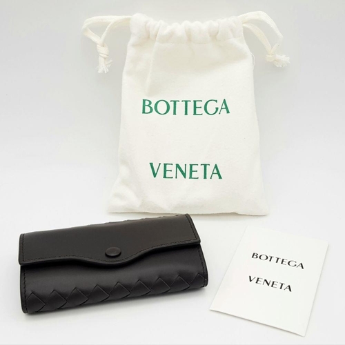 331 - A BOTTEGA VENETA WOVEN LEATHER KEY CASE, AS NEW WITH DUST COVER .