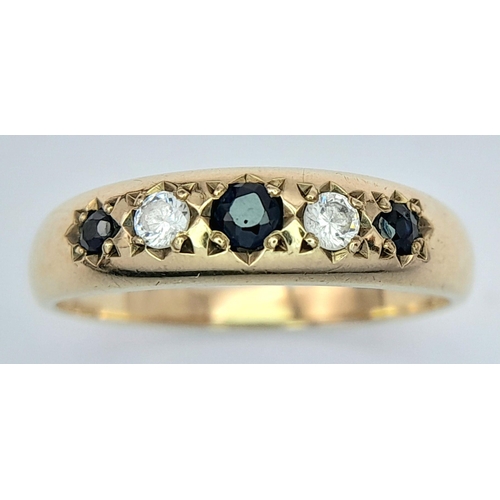 343 - 9 carat GOLD SPINEL and ZIRCONIA RING. Full UK hallmark. Complete with ring box .1.9 grams. Size N.