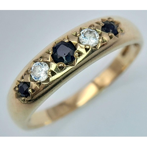 343 - 9 carat GOLD SPINEL and ZIRCONIA RING. Full UK hallmark. Complete with ring box .1.9 grams. Size N.