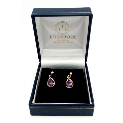 357 - Pair of 9 carat GOLD and AMETHYST EARRINGS. Pear Cut drop style. Complete with 9 carat gold backs. F... 