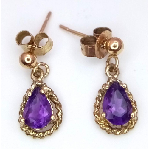 357 - Pair of 9 carat GOLD and AMETHYST EARRINGS. Pear Cut drop style. Complete with 9 carat gold backs. F... 