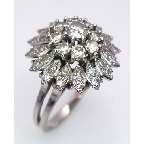 4 - A FABULOUS 3 TIERED DIAMOND CLUSTER RING SET IN 18K WHITE GOLD .    6.3gms    size O