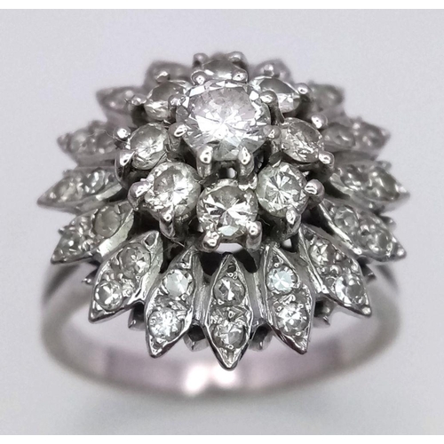 4 - A FABULOUS 3 TIERED DIAMOND CLUSTER RING SET IN 18K WHITE GOLD .    6.3gms    size O