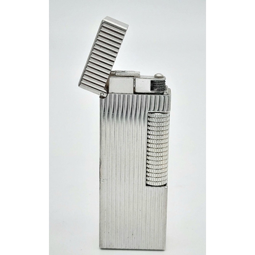 402 - A Classic Dunhill Silver-Tone Rectangular Lighter. Works but needs gas. In good condition. UK mainla... 