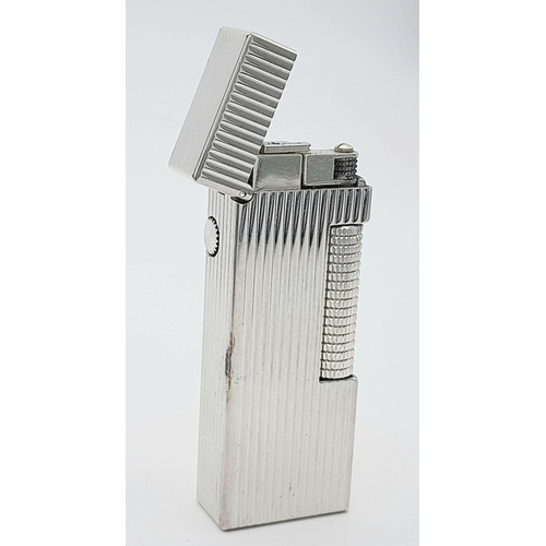 402 - A Classic Dunhill Silver-Tone Rectangular Lighter. Works but needs gas. In good condition. UK mainla... 