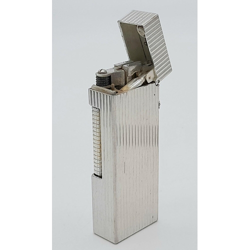 402 - A Classic Dunhill Silver-Tone Rectangular Lighter. Works but needs gas. In good condition. UK mainla... 