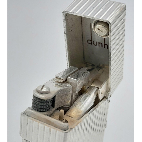 402 - A Classic Dunhill Silver-Tone Rectangular Lighter. Works but needs gas. In good condition. UK mainla... 