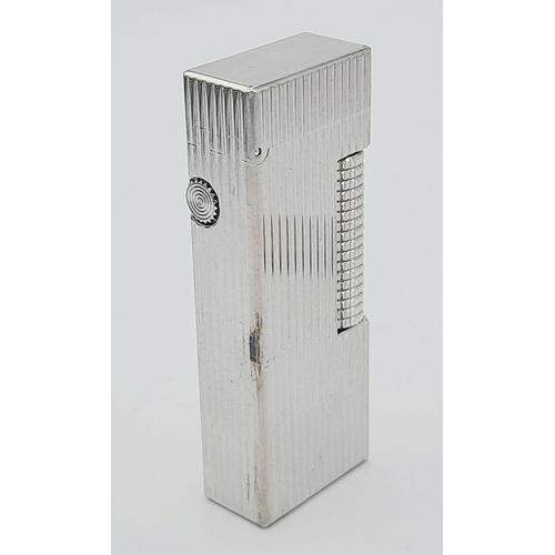 402 - A Classic Dunhill Silver-Tone Rectangular Lighter. Works but needs gas. In good condition. UK mainla... 