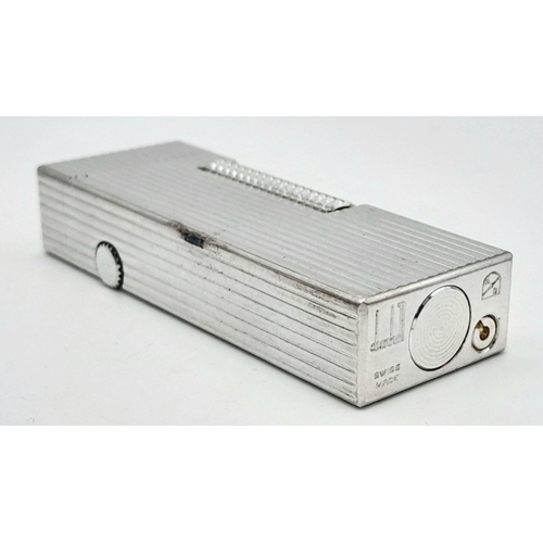 402 - A Classic Dunhill Silver-Tone Rectangular Lighter. Works but needs gas. In good condition. UK mainla... 