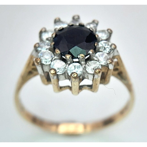 413 - Stunning  9 carat GOLD RING,  having lab SAPPHIRE set to top with sparkling ZIRCONIA surround. Fully... 