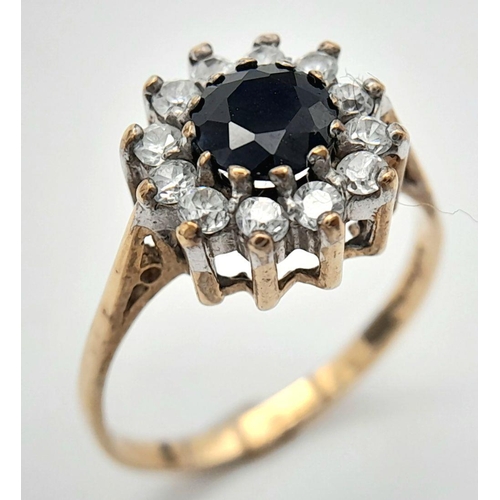 413 - Stunning  9 carat GOLD RING,  having lab SAPPHIRE set to top with sparkling ZIRCONIA surround. Fully... 