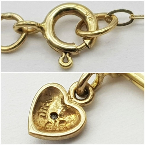 438 - A 9K Yellow Gold stone set T-bar Heart pendant on 16