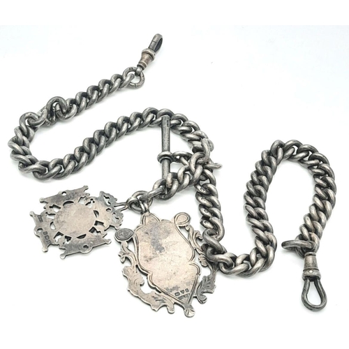 44 - A SILVER DOUBLE ALBERT WATCH CHAIN WITH 2 NICE SILVER FOBS AND WONDERFUL USED PATINA . 101gms