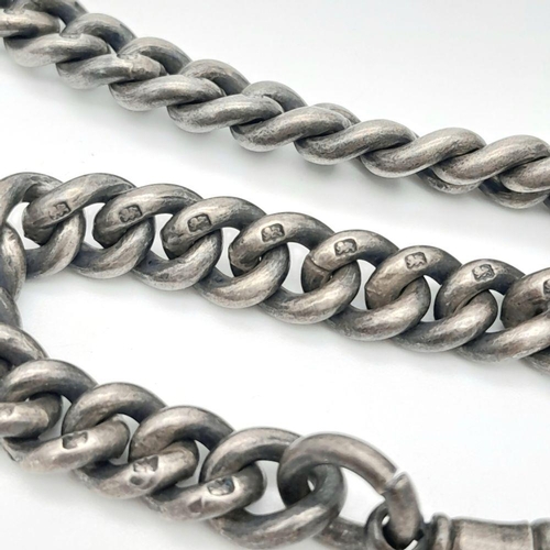 44 - A SILVER DOUBLE ALBERT WATCH CHAIN WITH 2 NICE SILVER FOBS AND WONDERFUL USED PATINA . 101gms