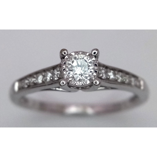 533 - A 9K white gold diamond ring with diamond set shoulders, size N, (dia:0.25ct). Total weight 2g. Ref ... 