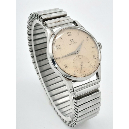 63 - Gentlemans Vintage 1950’s OMEGA WRISTWATCH. Finished in stainless steel with expandable bracelet. Su... 