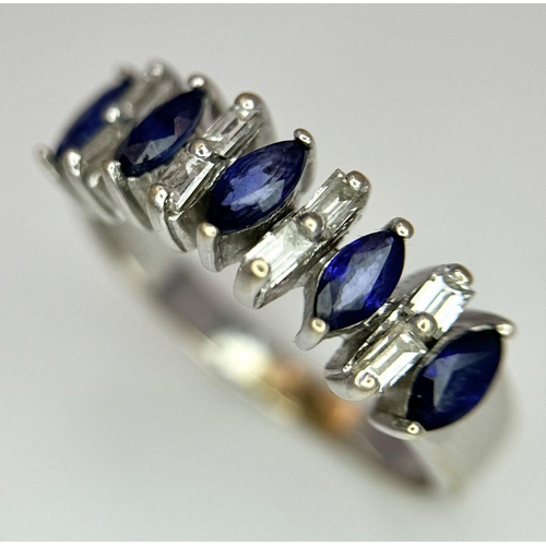 74 - An 18K White Gold Alternating Marquise Cut Sapphire and Baguette Cut Diamond Ring. Size P/Q. 4.5g to... 