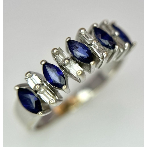 74 - An 18K White Gold Alternating Marquise Cut Sapphire and Baguette Cut Diamond Ring. Size P/Q. 4.5g to... 