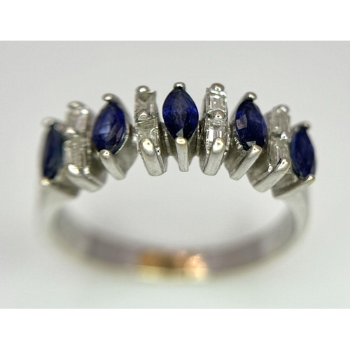 74 - An 18K White Gold Alternating Marquise Cut Sapphire and Baguette Cut Diamond Ring. Size P/Q. 4.5g to... 