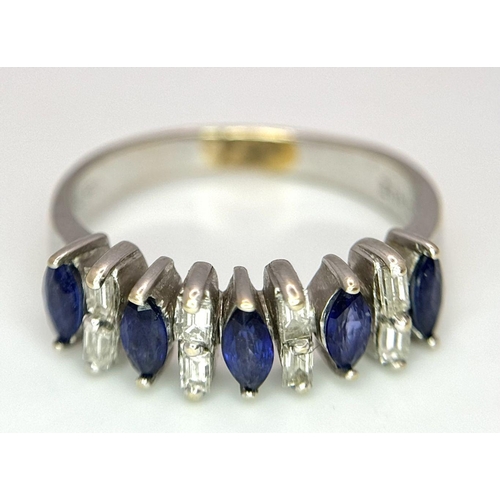 74 - An 18K White Gold Alternating Marquise Cut Sapphire and Baguette Cut Diamond Ring. Size P/Q. 4.5g to... 