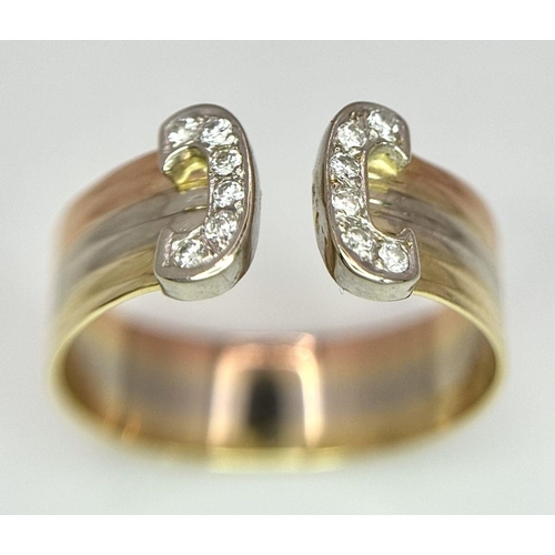 81 - An 18K Tri-Colour Gold Diamond Dress Ring. Size Q/R. 3.8g total weight.