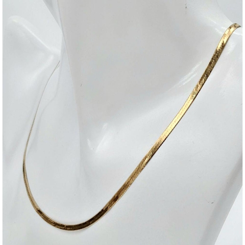 92 - A 40cms FLAT HERRINGBONE LINK NECKLACE IN 9K GOLD .     3.3GMS