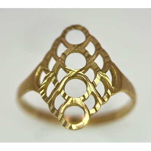 241 - A 9K Yellow Gold Ring with Pierced Circle Decoration. Size N. 1.4g.