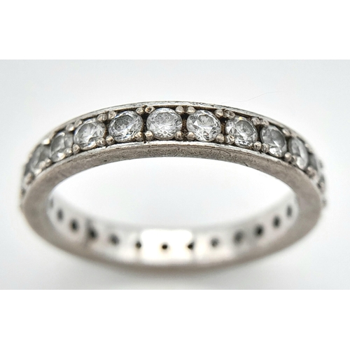 225 - A STONE SET FULL SILVER ETERNITY RING  .   4.8gms   size T