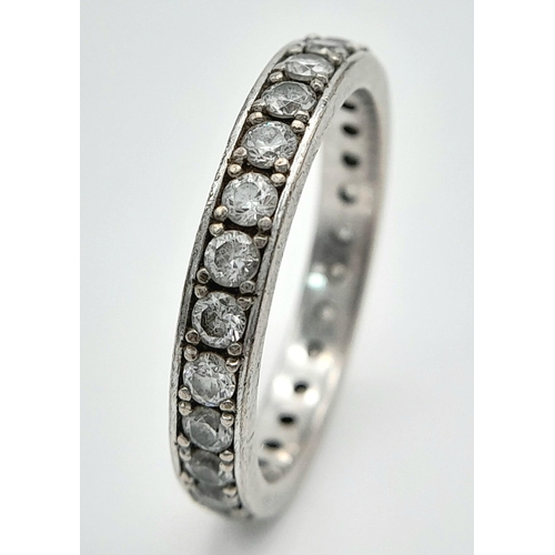 225 - A STONE SET FULL SILVER ETERNITY RING  .   4.8gms   size T