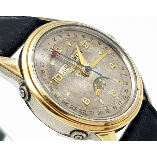 303 - A VINTAGE MOVADO GENTS WATCH IN GOLD AND STAINLESS STEEL WITH GREAT PATINA TO THE DIAL ,  MANUAL MOV... 